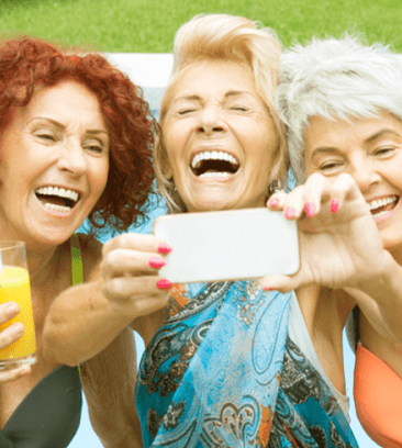 three older ladies taking selfie