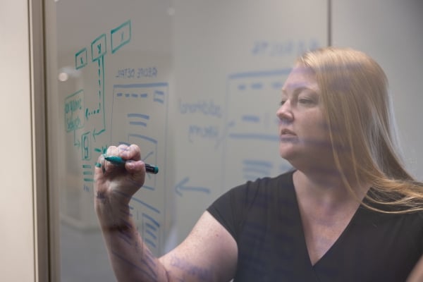 Kelly Kautz writing on a board