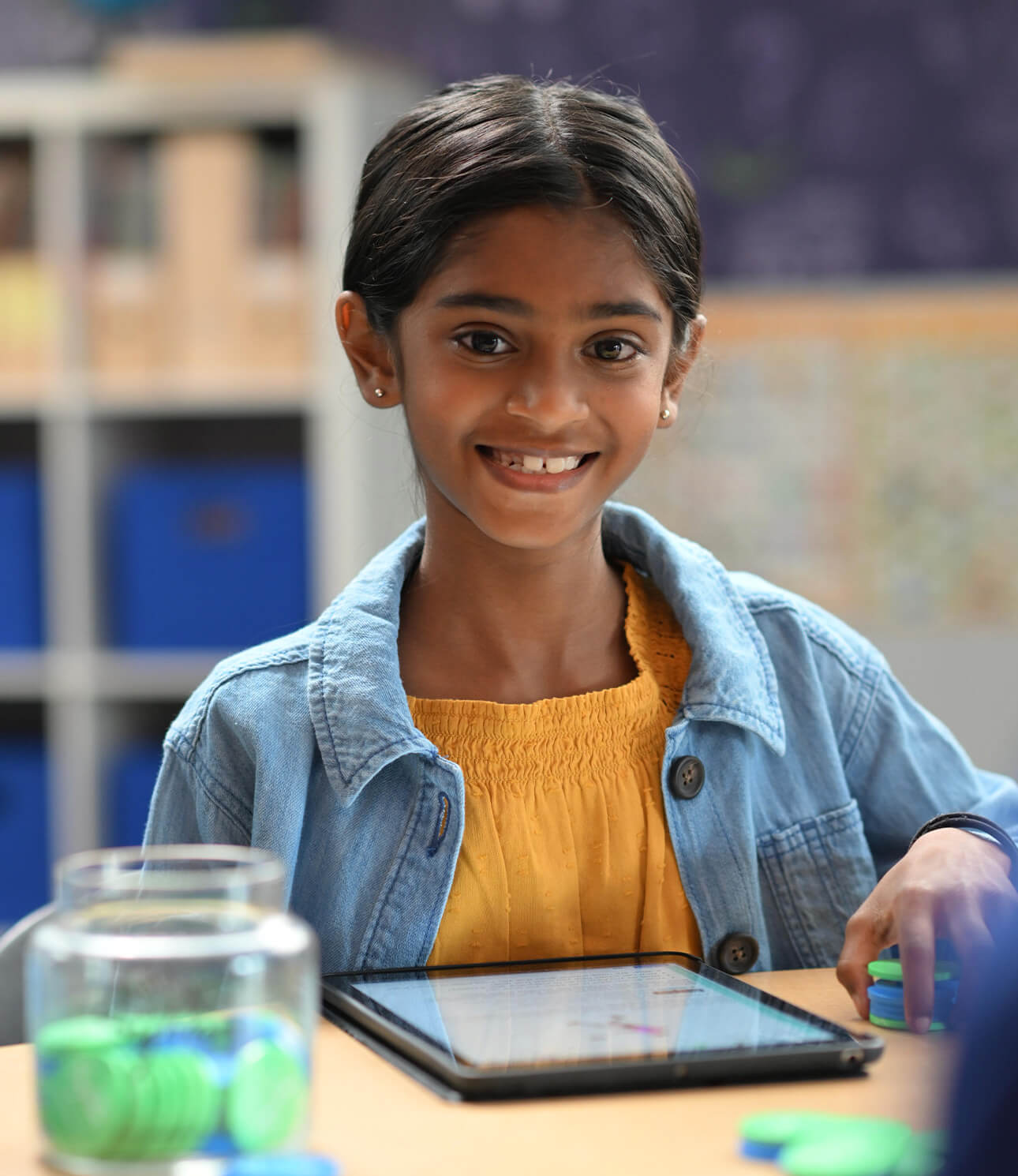 young female sylvan student smiling at the camera