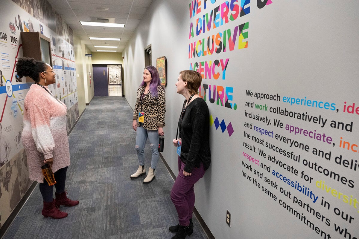 people standing in a hallway