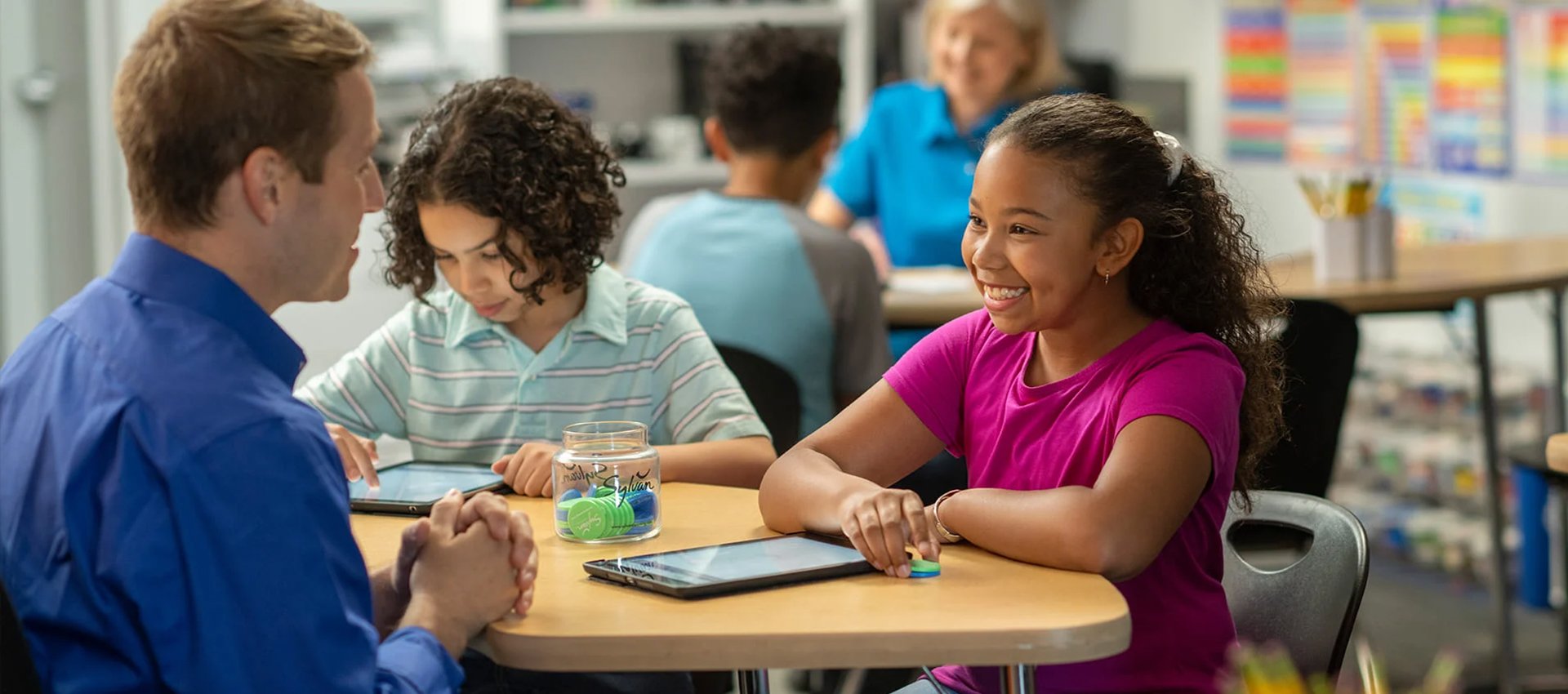 tutor advising two child students