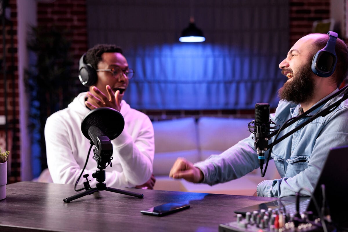 Skillful podcaster interviews a person in a lively discussion.
