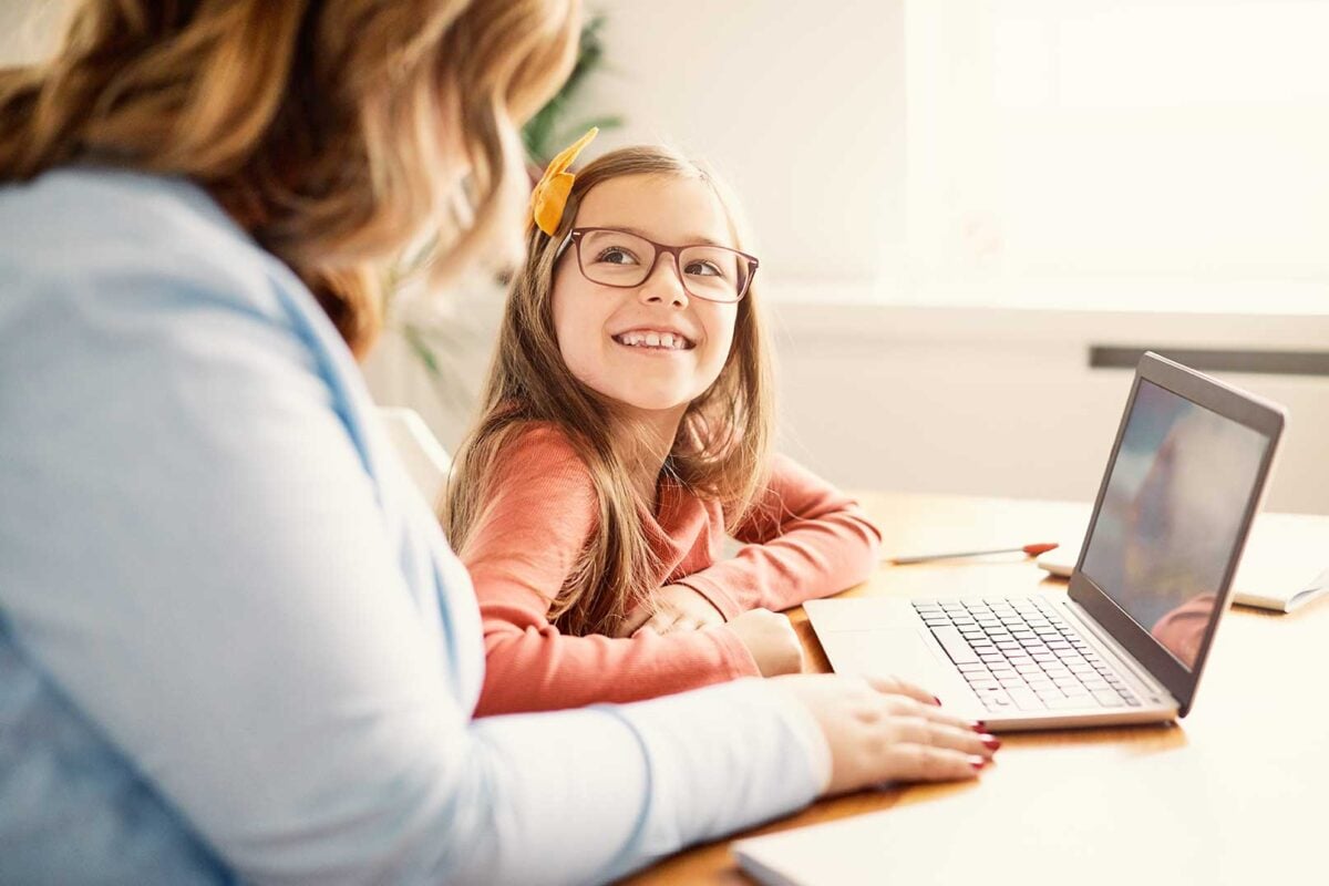 Parent and child on laptop - parents view on Education blog