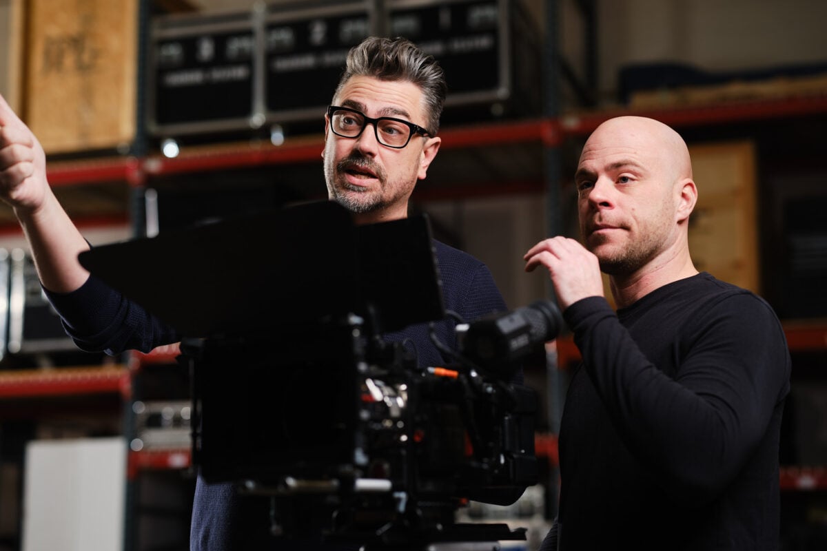 two people directing a shoot with a camera