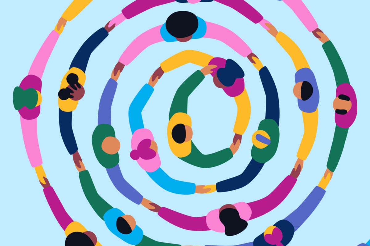 Big group of people holding hands together making a round circle shape representing community