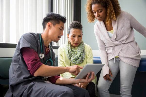 Doctor consulting with a family.