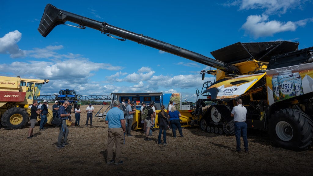 people viewing a twin rotor combine