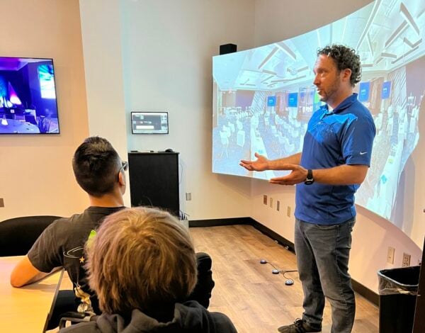Ryan Pudloski holds a demo in JPL's Experiential Lab Demo