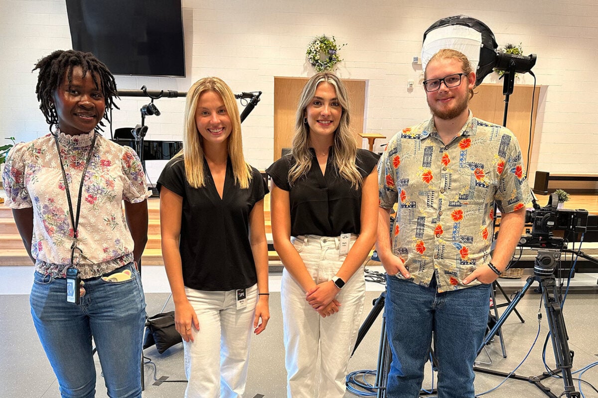 four student interns with studio equipment