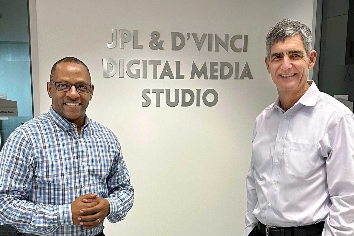 two people in front of sign that reads JPL & D'Vinci Digital Media Studio