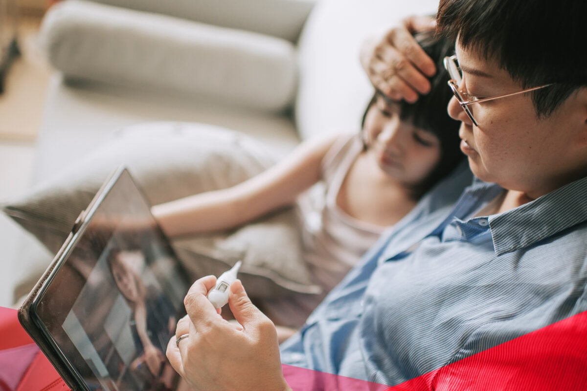 a person and a child looking at a computer screen