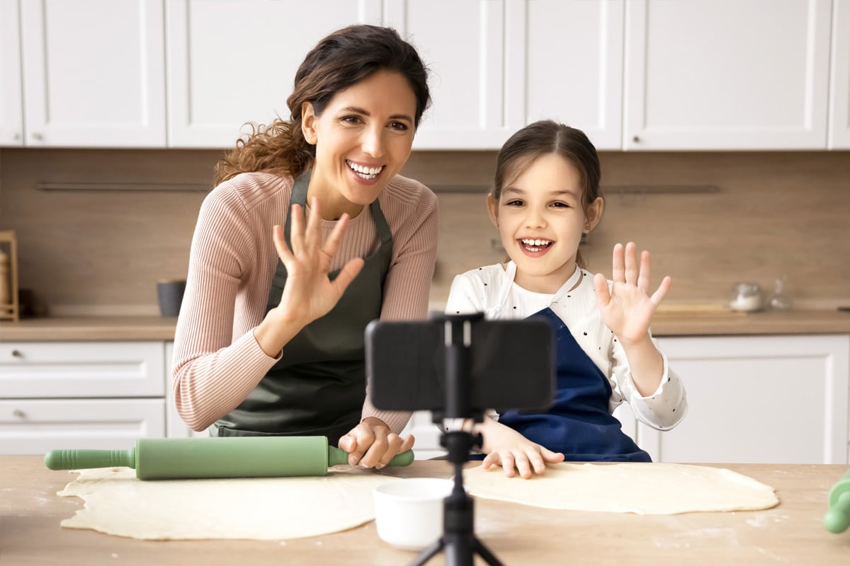 Momfluencer and daughter recording a cooking demonstration