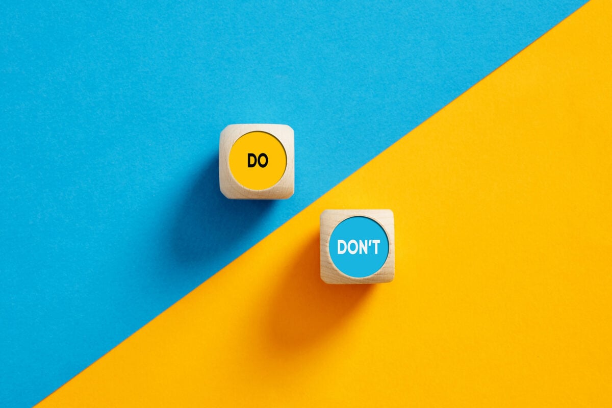 The words Do and Don't on wooden cube push buttons. Do's and Don'ts concept.