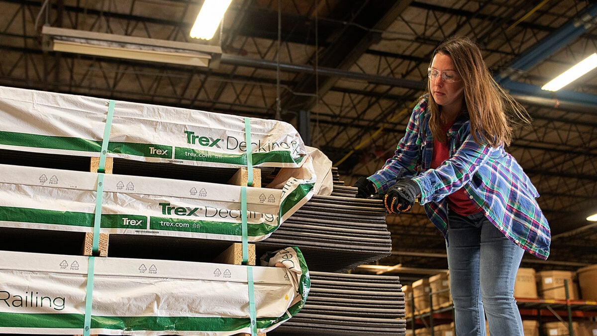 woman unpacking trex branded materials