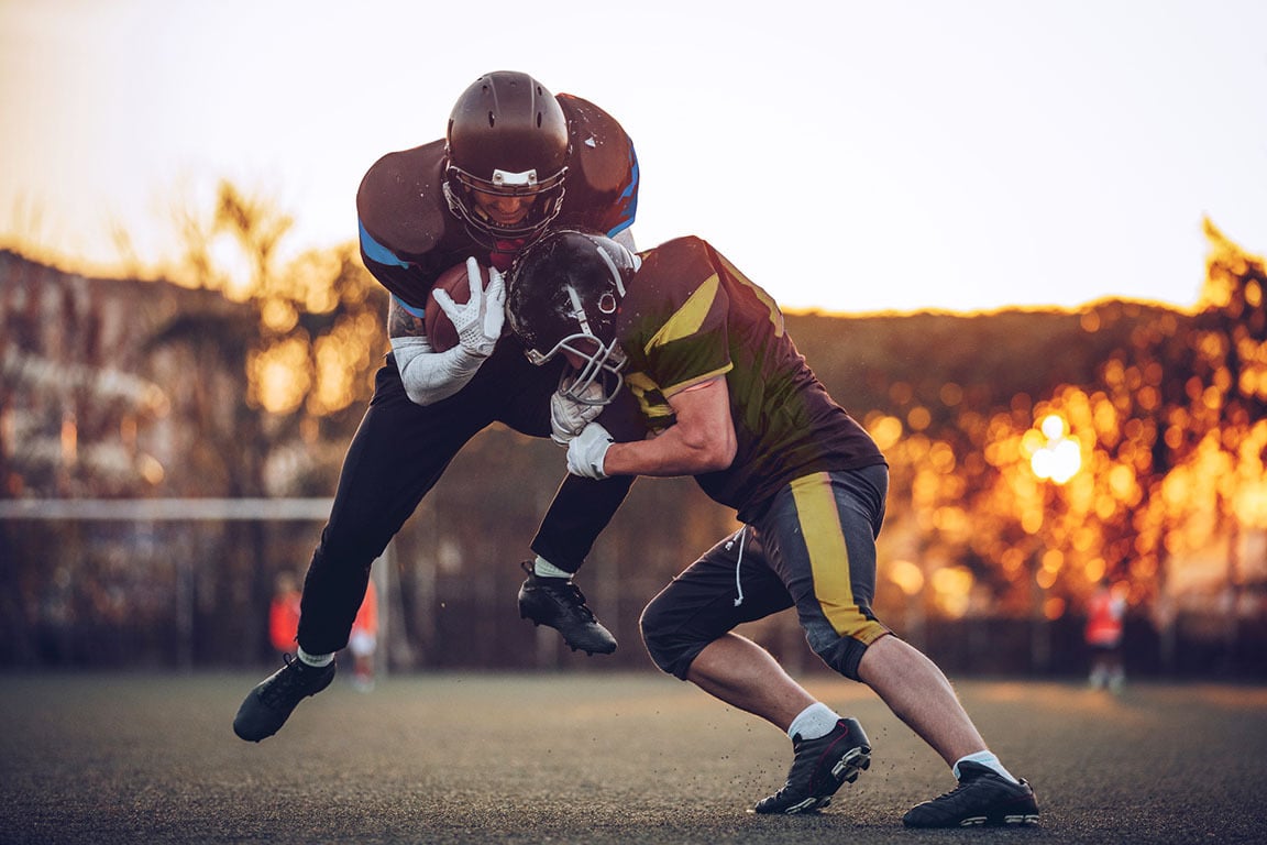 Football players in a tackle