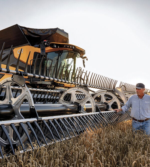 farmer with New Holland combine