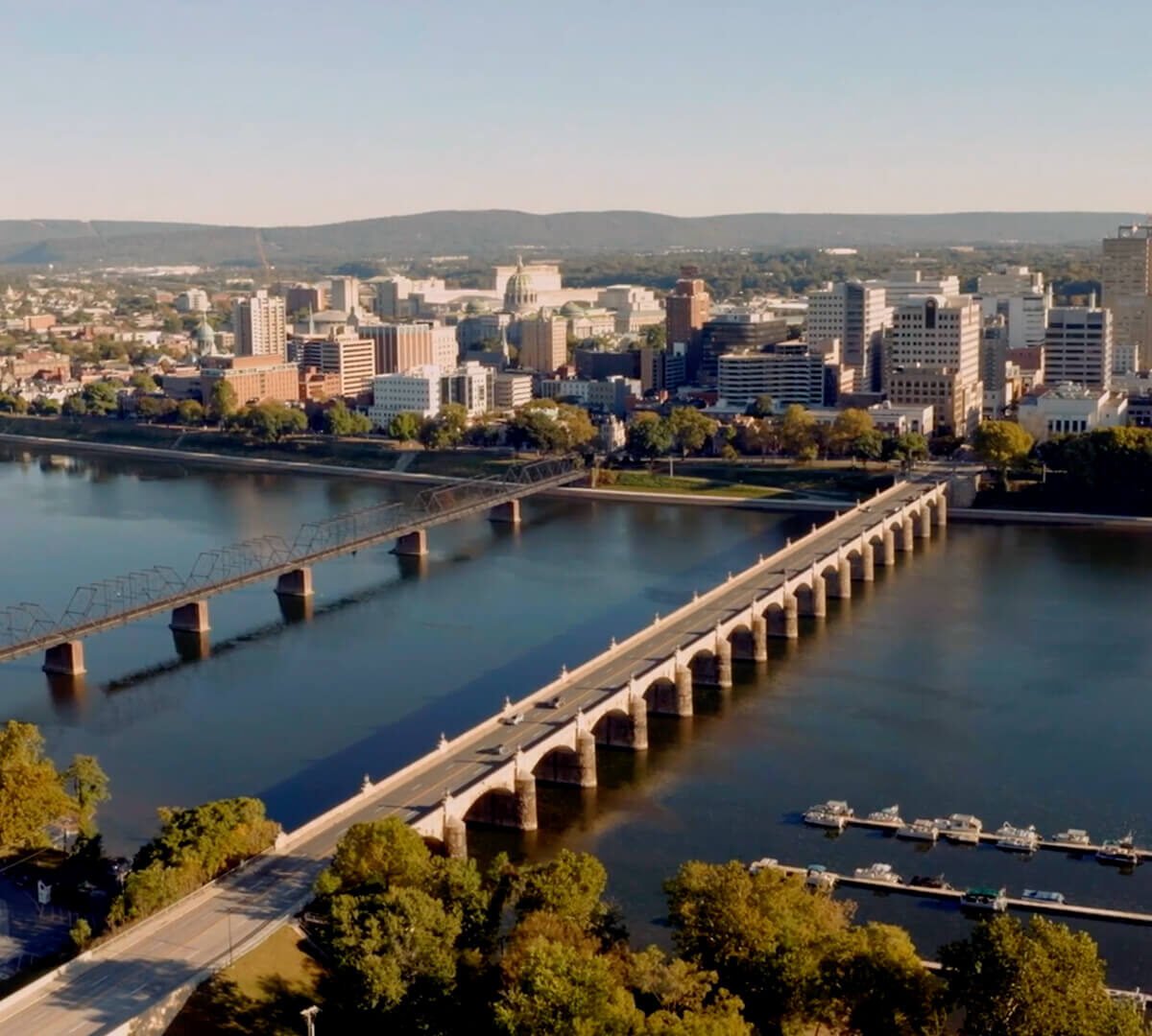 Drone photo of the city of Harrisburg over the river.