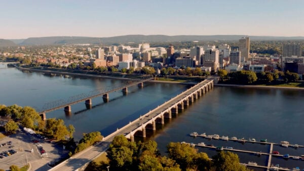 Drone photo of the city of Harrisburg over the river.